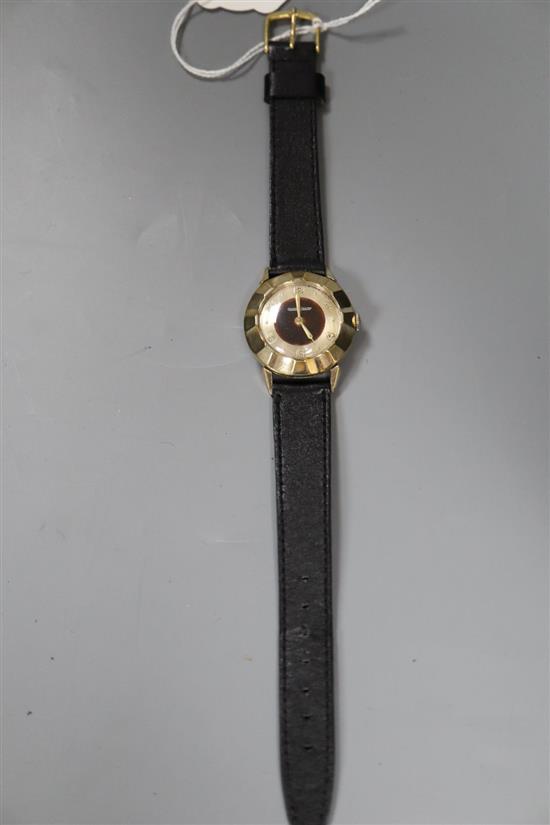 A gentlemans 10k gold filled Jaeger Le Coultre manual wind wrist watch, with panelled bezel, on a leather strap.